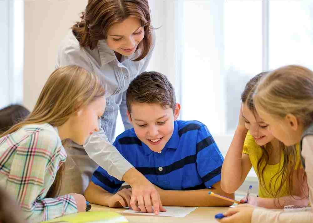 A teacher helping a student at school.