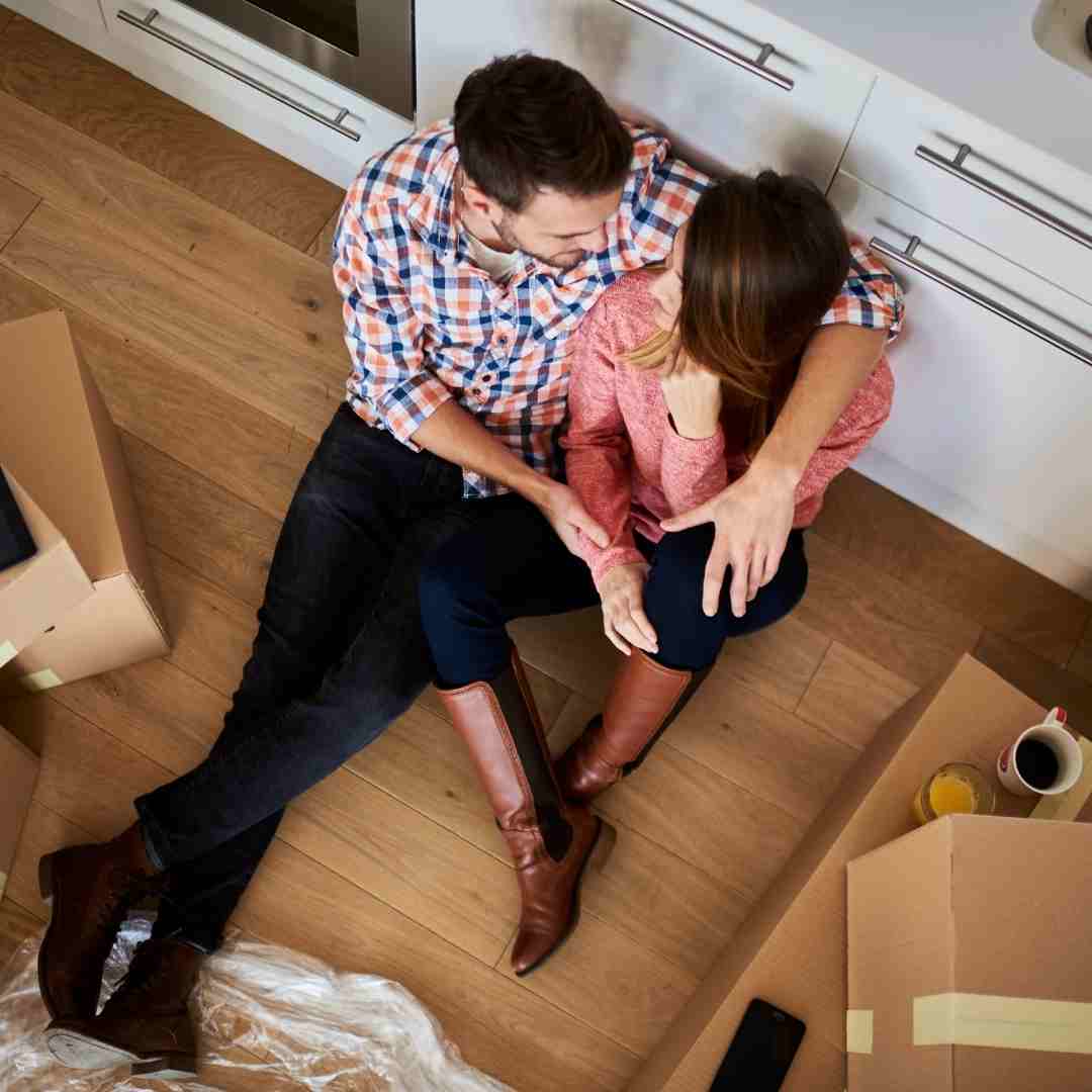 A couple unpacking in their apartment.