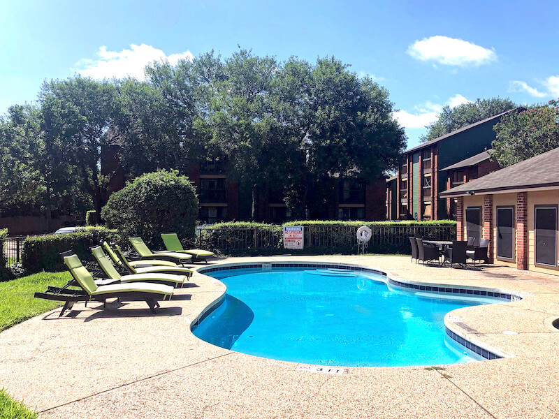 Englewood pool with lounge chairs on the side.